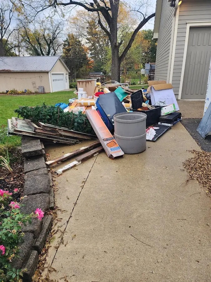 Dumpster being loaded with debris for 30 Yard Dumpster Rental in Bennettsville